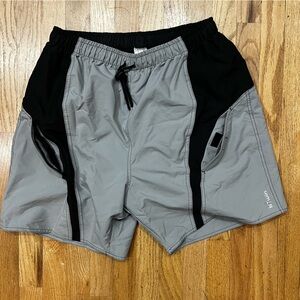 New XL bike shorts by BTWIN w interior padded mesh shorts. B&W exterior pockets.
